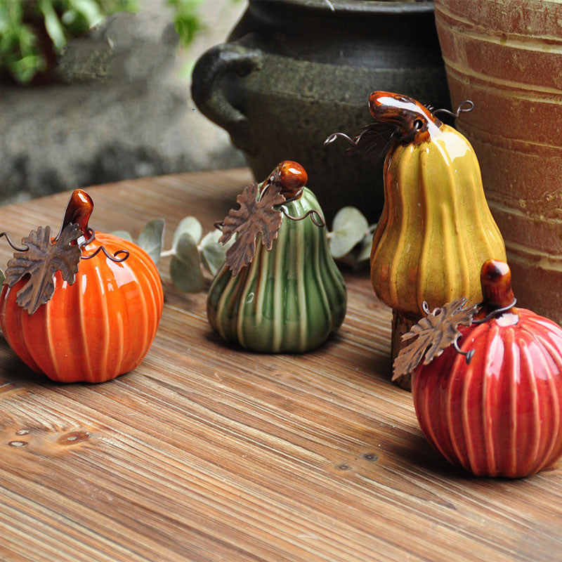 Glazed Ceramic Pumpkin — the four colors together on a wooden table