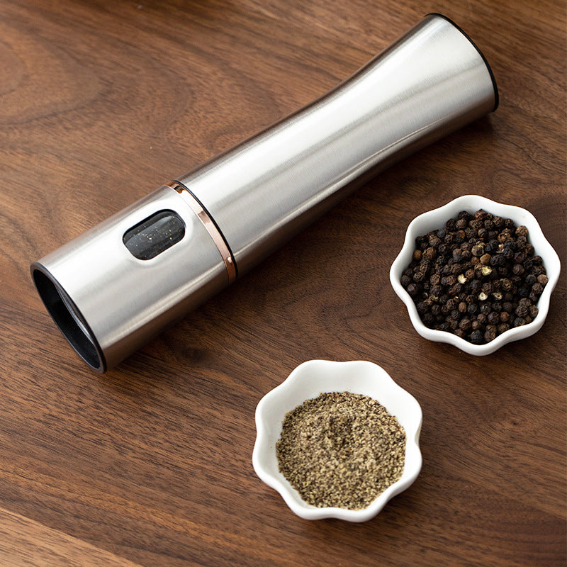 Electric Salt & Pepper Grinder — brushed steel grinder on a walnut board with peppercorns