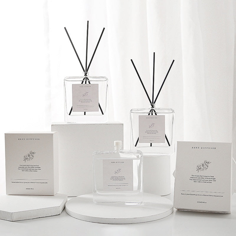 Minimalist Reed Diffuser — bottle, reeds and white box on a shelf