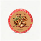 Argan & Cinnamon Shampoo Bar — round rust-red bar on white
