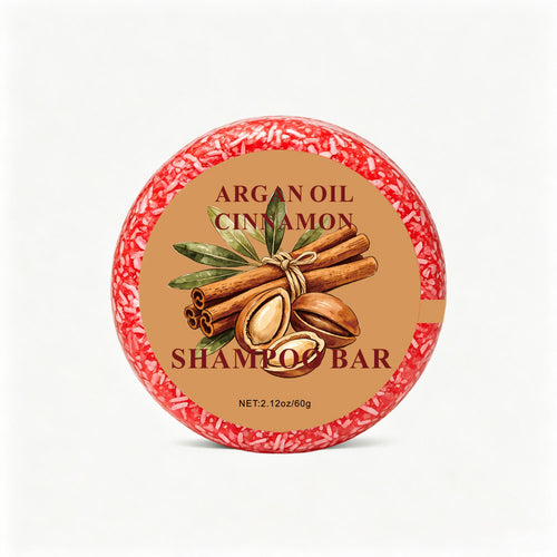 Argan & Cinnamon Shampoo Bar — round rust-red bar on white